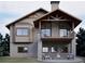 Attractive home showcasing a walkout basement, patio with fire pit, and an inviting covered balcony above at 680 Lone Eagle Dr, Granby, CO 80015