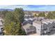 Aerial view of a residential community with well-maintained buildings, lush greenery, and mountain views at 6725 W 84Th Way # 67, Arvada, CO 80003