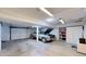 Spacious garage featuring a car, storage shelves and cabinets providing ample space for parking and organization at 6725 W 84Th Way # 67, Arvada, CO 80003