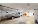 An oversized garage featuring a car and ample space for storage and projects, with fun decorations at 6725 W 84Th Way # 67, Arvada, CO 80003