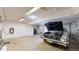 An oversized garage featuring a car and ample space for storage and projects at 6725 W 84Th Way # 67, Arvada, CO 80003