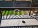 Backyard deck featuring privacy fence, green grass, and shaded views at 2619 S Iris Ct, Lakewood, CO 80227