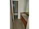 Bathroom featuring a vanity with granite countertop and neutral tile in the shower at 2619 S Iris Ct, Lakewood, CO 80227