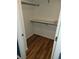 Small closet with wood-look flooring and one shelf at 2619 S Iris Ct, Lakewood, CO 80227