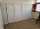 Spacious closet with double sliding doors ideal for storage and organization at 2619 S Iris Ct, Lakewood, CO 80227