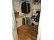 Walk-in closet with wood floor, shelving and hanging rods at 2619 S Iris Ct, Lakewood, CO 80227