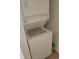 Stacked washer and dryer with detergent bottle at 2619 S Iris Ct, Lakewood, CO 80227