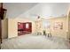 Spacious basement with a seating area, adjacent to a recreation area with a pool table, great for entertaining at 132 Mesa St, Brighton, CO 80601