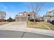 Charming two-story home with a well-manicured front yard and two-car garage, perfect for suburban living at 132 Mesa St, Brighton, CO 80601