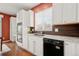 Bright kitchen features white cabinets, stainless steel appliances, and an undermount sink for a modern look at 132 Mesa St, Brighton, CO 80601