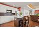 Modern kitchen with white cabinets, stainless steel appliances, granite countertops and wood floors for a stylish design at 132 Mesa St, Brighton, CO 80601