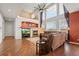 Bright living room with fireplace and soaring ceilings provides an airy and inviting space to relax or entertain at 132 Mesa St, Brighton, CO 80601
