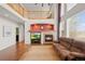 The living room offers a fireplace, media center, and a cathedral ceiling with clerestory windows at 132 Mesa St, Brighton, CO 80601