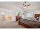 Main bedroom featuring a spacious layout, vaulted ceiling and stairs to the upper level at 132 Mesa St, Brighton, CO 80601