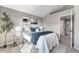 Bright bedroom with gray walls and carpet and stylish decor at 12018 Hudson Ct, Thornton, CO 80241