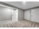 Open bedroom featuring light gray walls, carpet, closet, and two doorways at 12018 Hudson Ct, Thornton, CO 80241