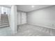 Spacious bedroom with neutral tones, carpet, and adjacent staircase for easy access at 12018 Hudson Ct, Thornton, CO 80241