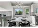 Bright dining area features a modern chandelier and neighborhood views at 12018 Hudson Ct, Thornton, CO 80241