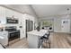 Spacious open concept kitchen with stainless steel appliances and island at 12018 Hudson Ct, Thornton, CO 80241