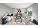Contemporary living room with stylish furnishings, modern art, and plenty of natural light at 12018 Hudson Ct, Thornton, CO 80241