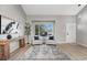 Bright living room featuring a large window and modern decor at 12018 Hudson Ct, Thornton, CO 80241