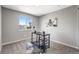 Cozy office space with stylish desk, contemporary art, and a large window with neighborhood views at 12018 Hudson Ct, Thornton, CO 80241