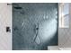Modern shower with blue tiled walls at 12018 Hudson Ct, Thornton, CO 80241