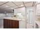Basement bar area features a sink, white cabinets, and easy access to the nearby bathroom at 1118 Eagle Rd, Broomfield, CO 80020