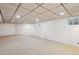 Unfurnished basement with carpet, neutral walls, drop ceiling, and windows that bring in natural light at 1118 Eagle Rd, Broomfield, CO 80020