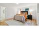 Bedroom featuring hardwood floors, neutral walls, and comfortable furniture at 1118 Eagle Rd, Broomfield, CO 80020
