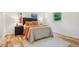 Cozy bedroom with hardwood floors, neutral walls, and comfortable furniture at 1118 Eagle Rd, Broomfield, CO 80020