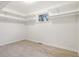 Spacious walk-in closet featuring a window and many shelves at 1118 Eagle Rd, Broomfield, CO 80020