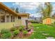 A charming exterior with well-manicured landscaping, lush lawns, and a decorative water feature on display at 1118 Eagle Rd, Broomfield, CO 80020
