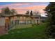 Stunning exterior with an outdoor deck, vibrant lawn, mature trees, and modern design elements with great natural lighting at 1118 Eagle Rd, Broomfield, CO 80020