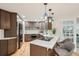Kitchen with stainless appliances, quartz counters, and pendant lights at 1118 Eagle Rd, Broomfield, CO 80020