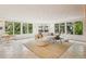 Spacious living room featuring curved sofa and lots of natural light at 1118 Eagle Rd, Broomfield, CO 80020