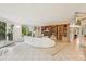 Bright and airy living room with curved sofa and built-in shelving at 1118 Eagle Rd, Broomfield, CO 80020