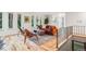 Bright living room with hardwood floors, area rug, and large windows at 1118 Eagle Rd, Broomfield, CO 80020