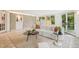 Bright living room featuring a curved sofa and a view to the backyard at 1118 Eagle Rd, Broomfield, CO 80020