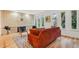 Cozy living room with hardwood floors, brick fireplace, and bright natural light at 1118 Eagle Rd, Broomfield, CO 80020