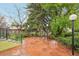 Large patio with stone and modern deck with lush yard, perfect for outdoor gatherings and relaxing in nature at 1118 Eagle Rd, Broomfield, CO 80020