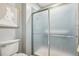 Bathroom shower stall with clear glass doors and light blue tiling at 1118 Eagle Rd, Broomfield, CO 80020