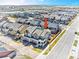 Stunning aerial view of a residential neighborhood with well-maintained homes and tree-lined streets at 700 Lillibrook Pl, Erie, CO 80026