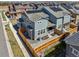 Aerial view of a gray home in a suburban neighborhood with solar panels at 700 Lillibrook Pl, Erie, CO 80026