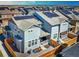 Backyard aerial view of home featuring solar panels, fencing, and an outdoor patio area at 700 Lillibrook Pl, Erie, CO 80026
