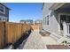 A peaceful backyard with a rock garden, privacy fence, and low maintenance landscaping at 700 Lillibrook Pl, Erie, CO 80026