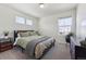 Cozy bedroom features soft lighting, a comfortable bed, and contemporary furnishings at 700 Lillibrook Pl, Erie, CO 80026