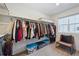 Spacious walk-in closet features ample storage, custom shelving, and natural light at 700 Lillibrook Pl, Erie, CO 80026