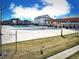 Community pool area featuring a large pool, pergola covered picnic area, and green space at 700 Lillibrook Pl, Erie, CO 80026
