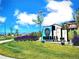Landscaped community entrance sign at Parkdale Bee with mountain views in the background at 700 Lillibrook Pl, Erie, CO 80026